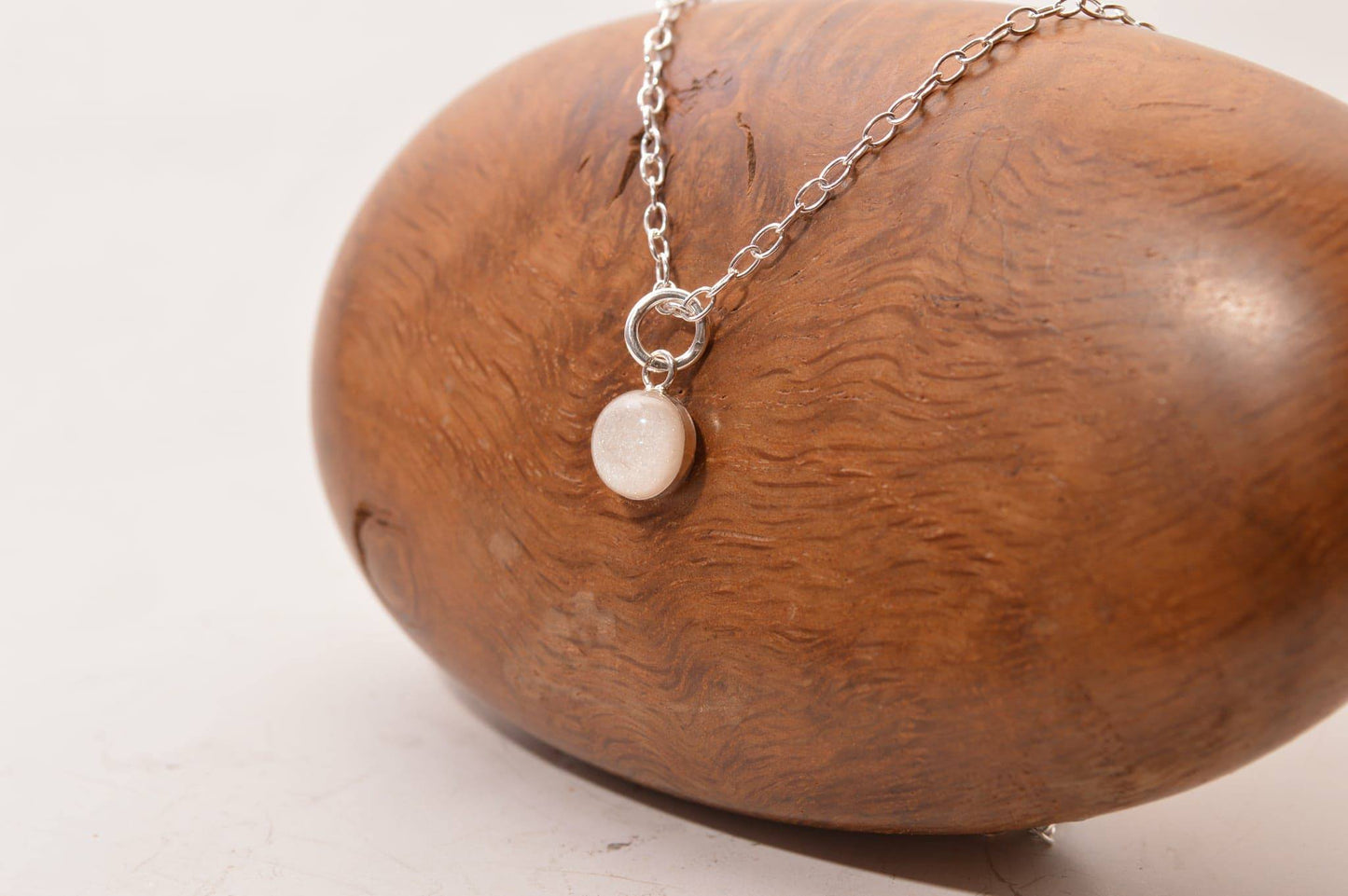 Round sterling silver backed pendant