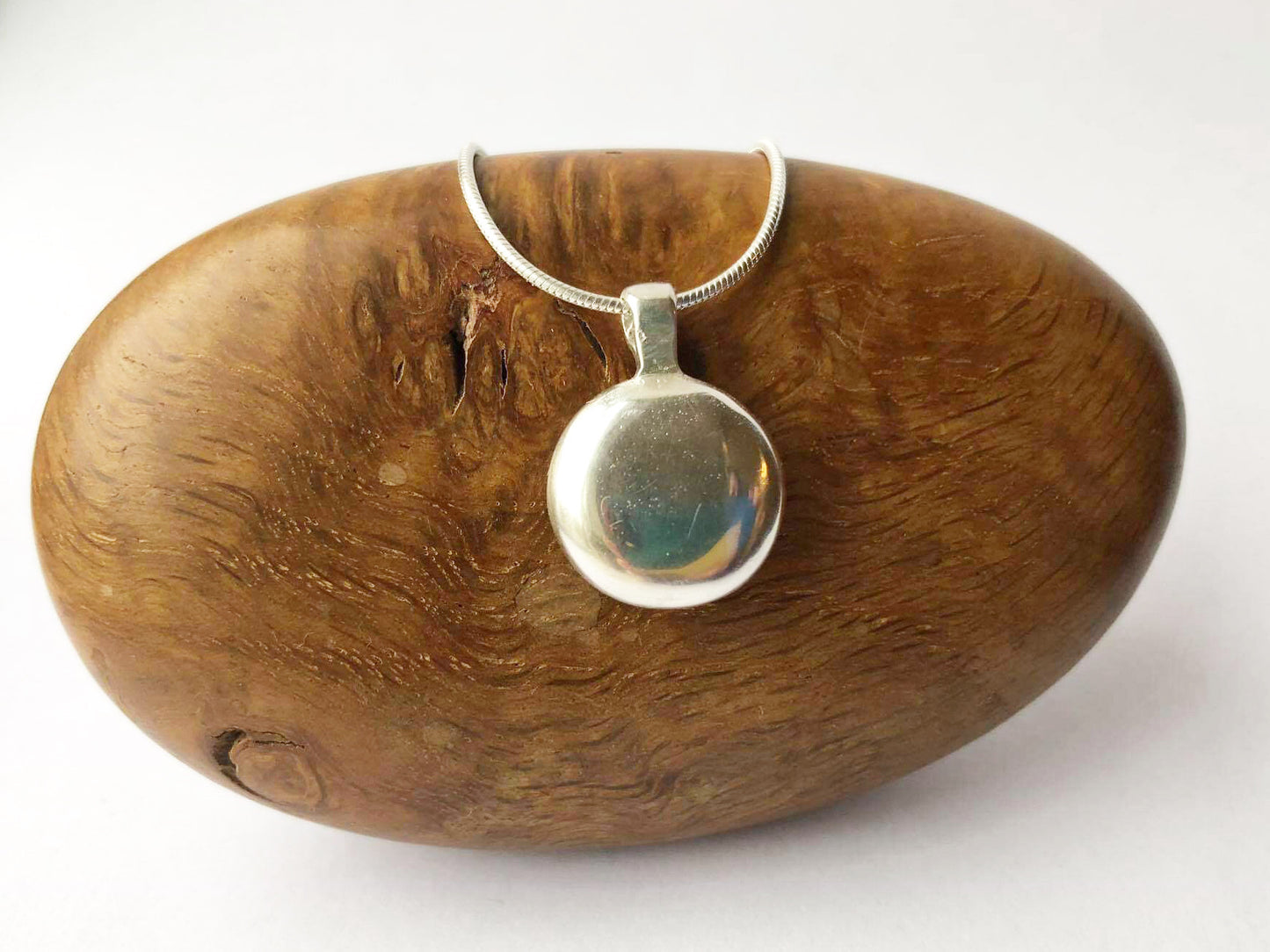 Medium hand cast sterling silver round pendant