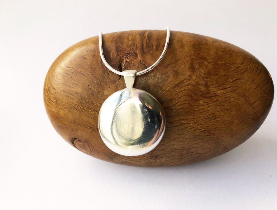 Large hand cast sterling silver round pendant